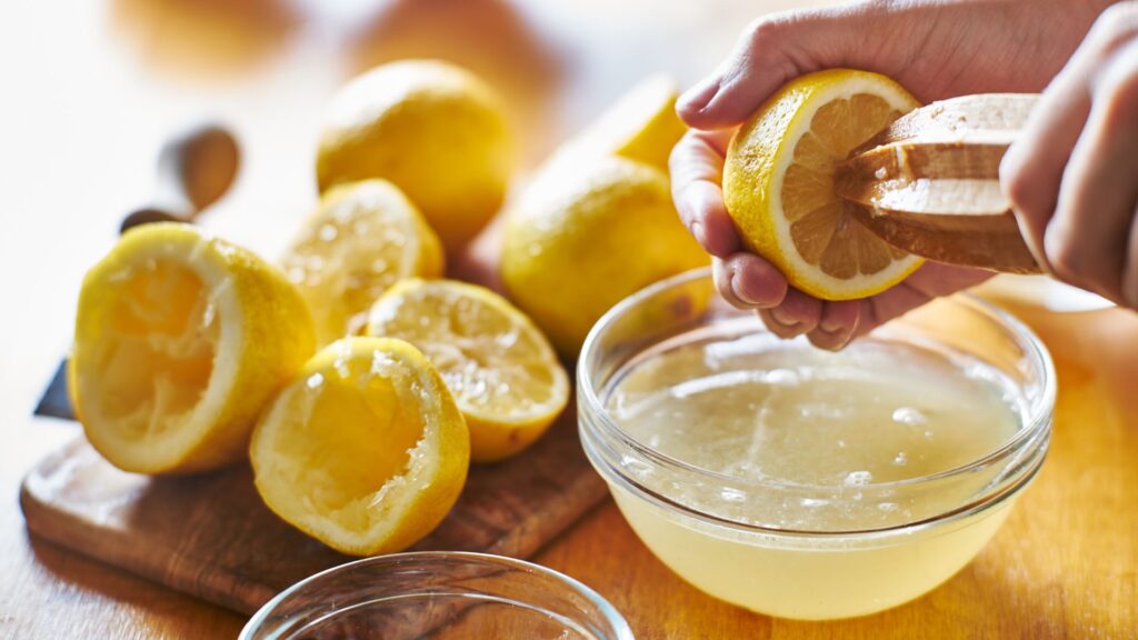 Hand juicing lemons