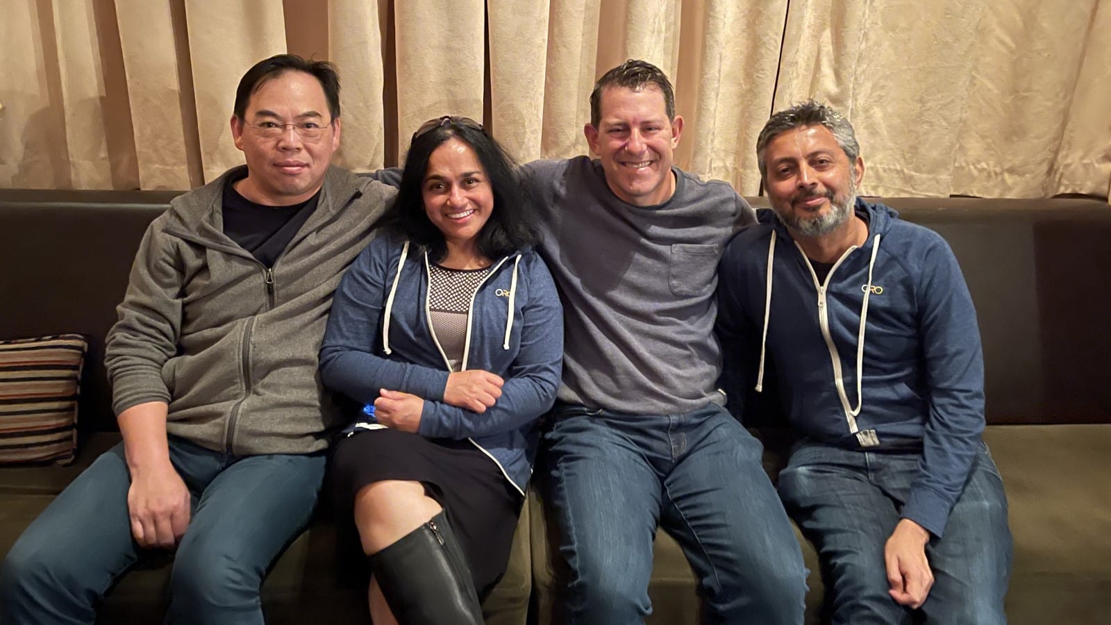 Yuan Tung, Lalitha Rajagopalan, Sean Jacobsohn, and Sudhir Bhojwani sitting together on a couch