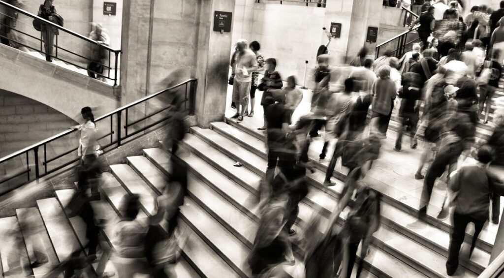 time lapse people walking in a train station