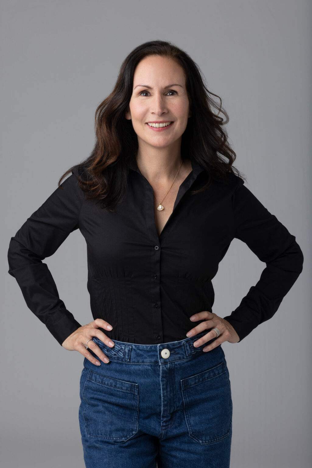 a woman in a black shirt posing for a picture.