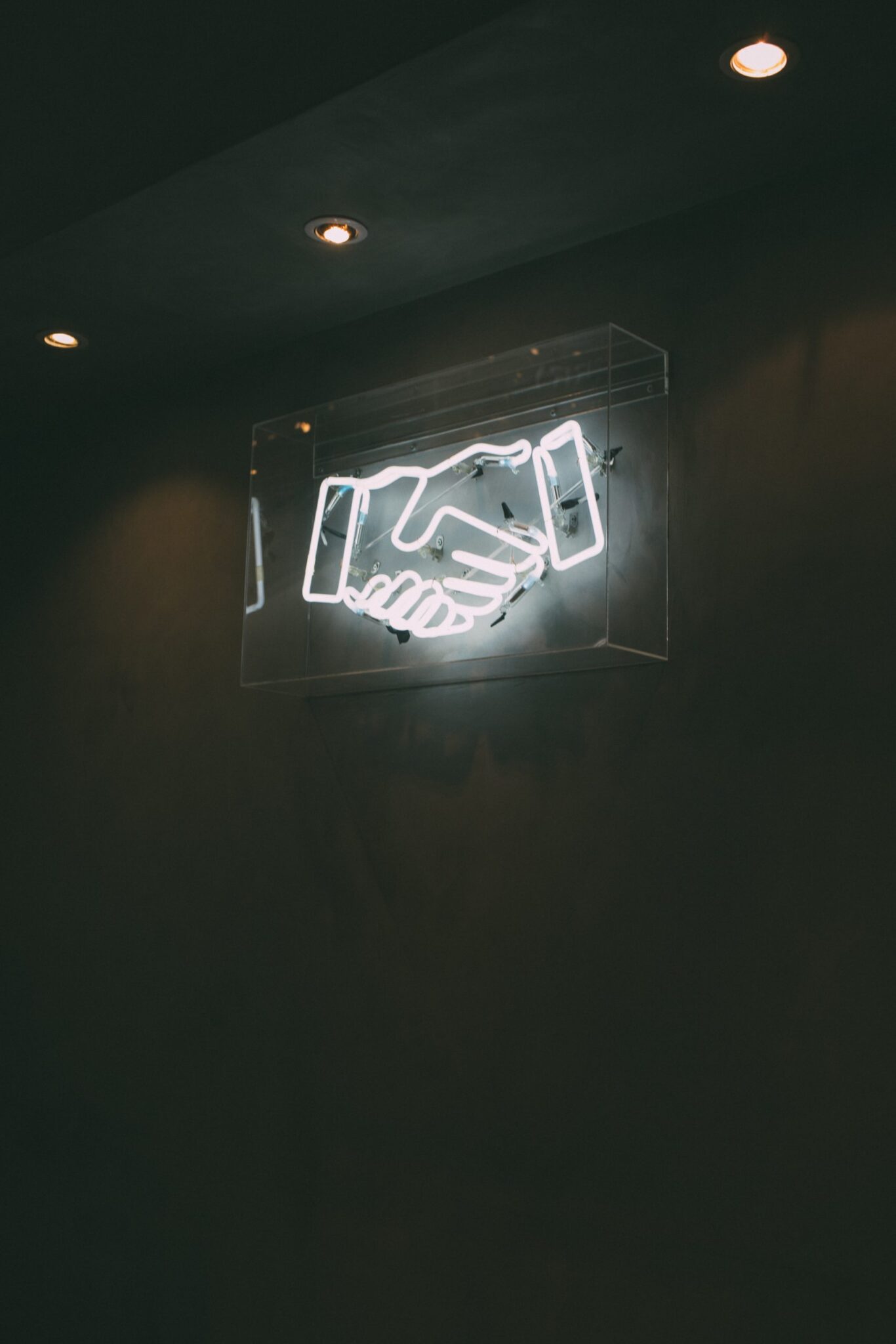 neon handshake sign