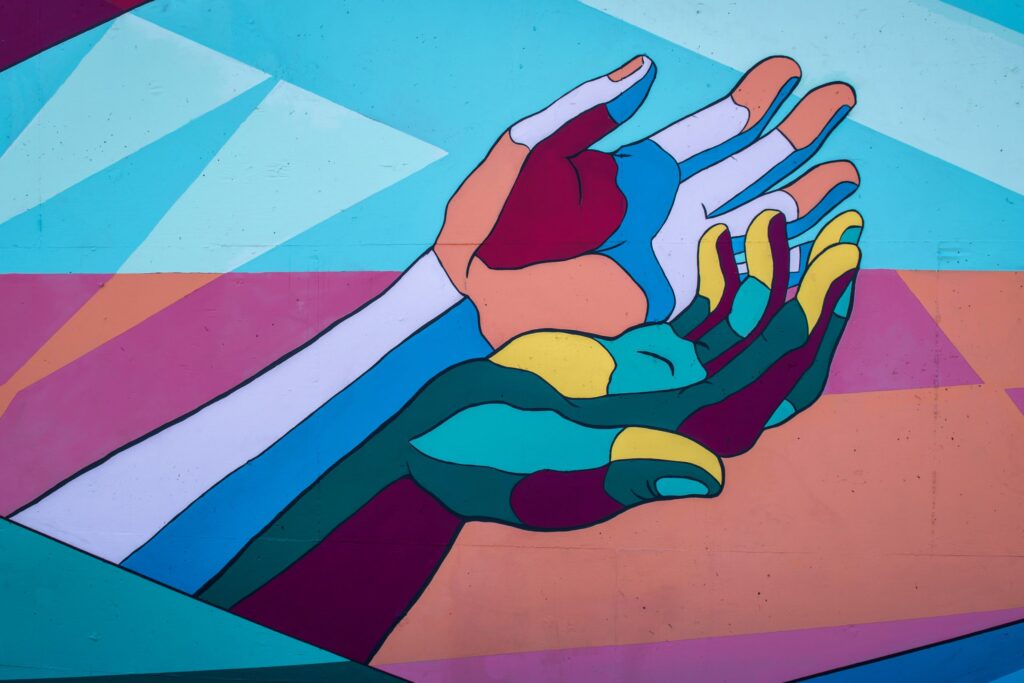 multi-colored hands painting