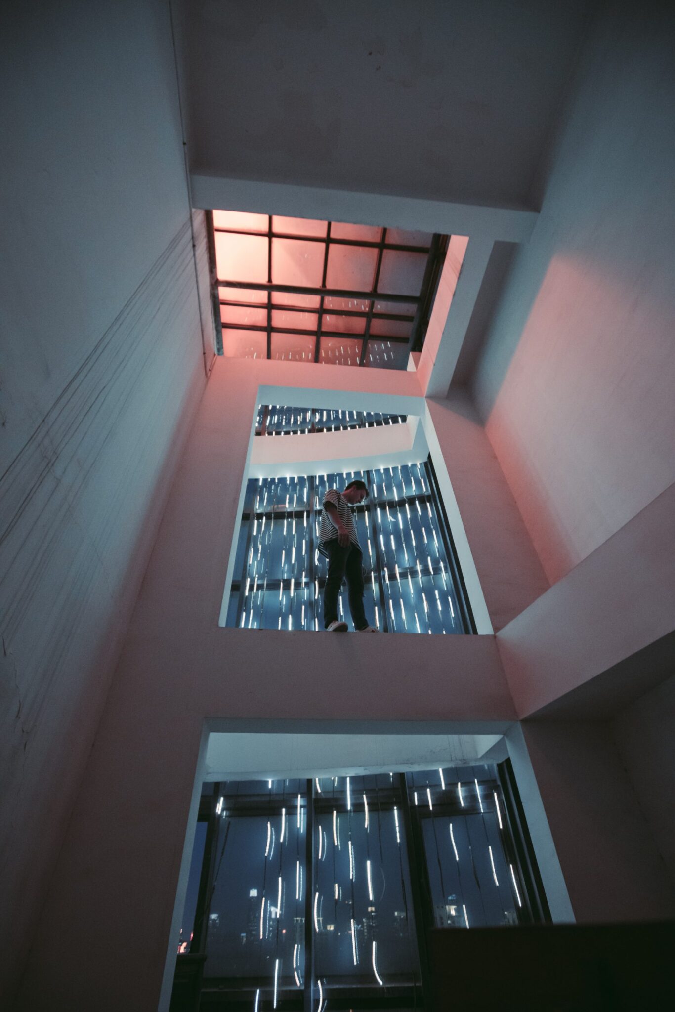 man standing in a window