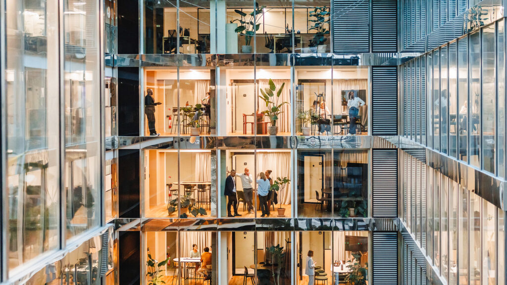 Multi-level building with people working on each floor